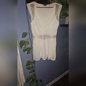 3/20.00. Classy white romper with sequins.